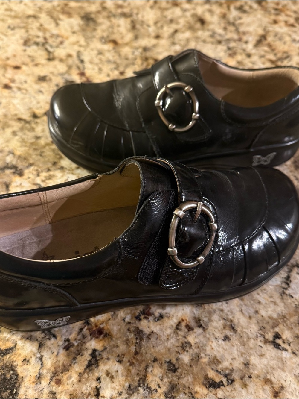 Alegria Black Leather Slip-On Loafers with Silver Ring Accent